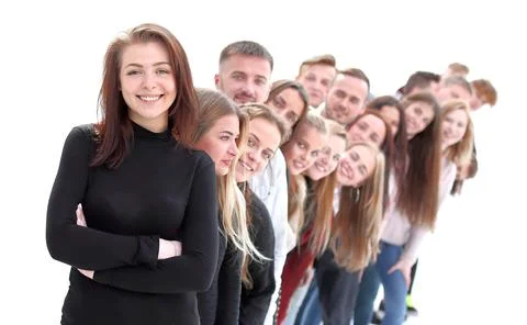 Confident guy standing first in the column of young people Stock Photos