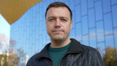 Confident handsome millennial man taking selfie, walking in autumn park outdoors Stock Footage 170478259