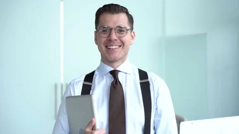 Confident happy businessman looking at camera in office Stock Footage 134461209