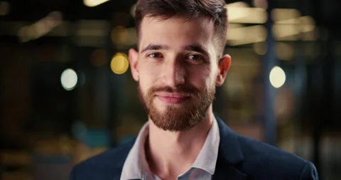 Confident happy man with beard looking at camera on city street, positive Video stock 224301214