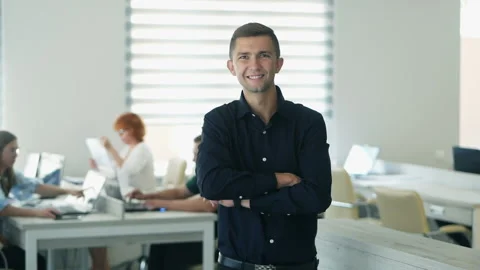 Confident happy office worker looking at camera in modern office, positive male Stock Footage 141735302