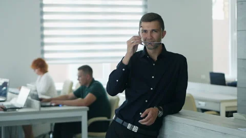 Confident happy office worker looking at camera in modern office, positive male Video stock 144974295