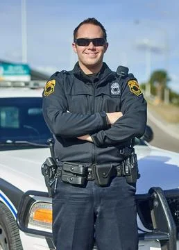 Confident in his ability to keep you safe. Cropped portrait of a handsome young Stock Photos