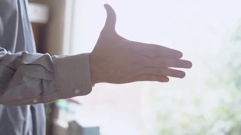 Confident hispanic man practicing handshake in front of mirror Stock Footage 84486111
