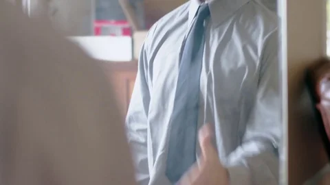 Confident hispanic man practicing handshake in front of mirror Stock Footage 84486743