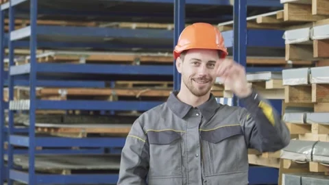 Confident industry worker in hardhat smiling proudly at the camera Stock Footage 311180461