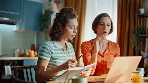 Confident ladies talking webinar gesturing to laptop web camera closeup. Stock Footage 333793225
