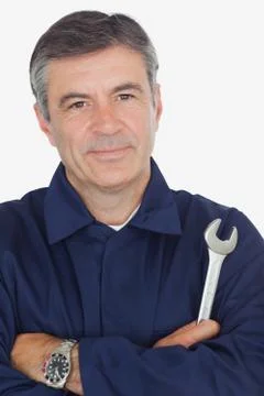 Confident machanic holding wrench Stock Photos