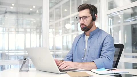Confident male corporate operator in headset working in customer support service Stock Footage 315030201