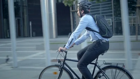 Confident male worker in shirt with a backpack commuting to a job 動画素材 74635508