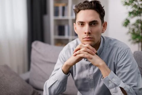 Confident man on couch Stock Photos