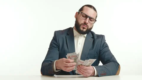 Confident Man Counting a Large Stack of Money Bills Stock Footage 265600750