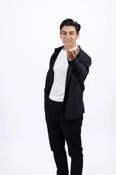 Confident man pointing finger at camera. Stock Photos