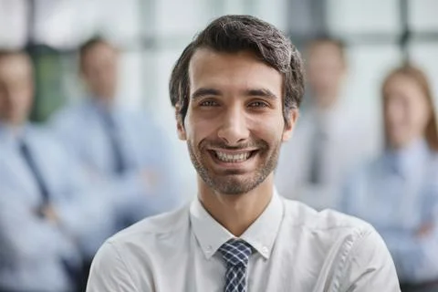 Confident man posing in front of his colleague during a meeting Stock Photos