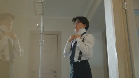 Confident man prepares. Man in suit readies for presentation confidently. Asian Stock Footage 337234152
