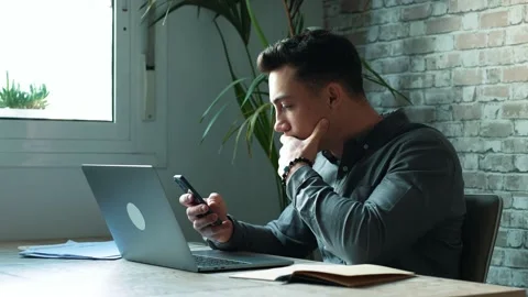 Confident man sitting at desk taking break in work with electronic document.. Stock-Footage 236929513