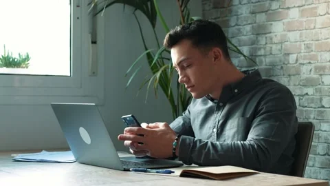Confident man sitting at desk taking break in work with electronic document.. Stock-Footage 236929652