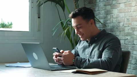 Confident man sitting at desk taking break in work with electronic document.. Stock Footage 236934276