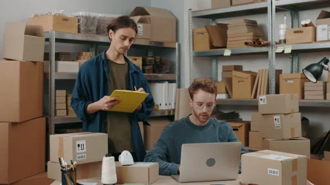 Confident man standing with folder at his hands and telling something to his Stock Footage 169467804