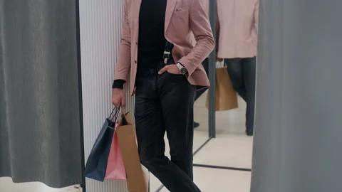 Confident Man in Stylish Outfit Waiting Outside Fitting Room Stock-Footage 311882953