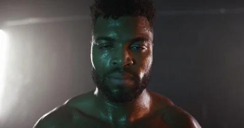 Confident man sweating while working out in the gym Stock Footage 116357612