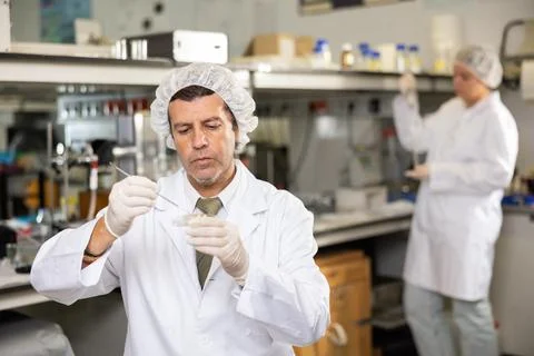 Confident man technician working in research laboratory Stock Photos
