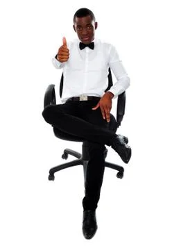 Confident man with thumbs-up gesture Stock Photos