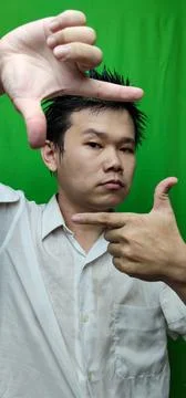 Confident Man Using Square Hand Gesture to Convey Clarity and Precision Stock Photos