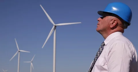 Confident Manager Image Wearing Hardhat Inspecting Wind Turbine Installations Video stock 109110027