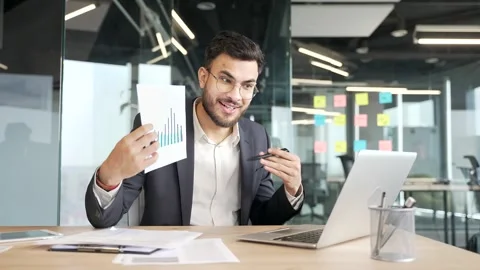 Confident manager presenting chart data at workspace in office. Businessman  Video stock 319777279