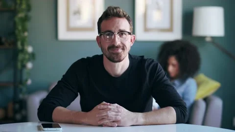 Confident mature man explaing something looking at camera while doing video c Stock Footage 161085390