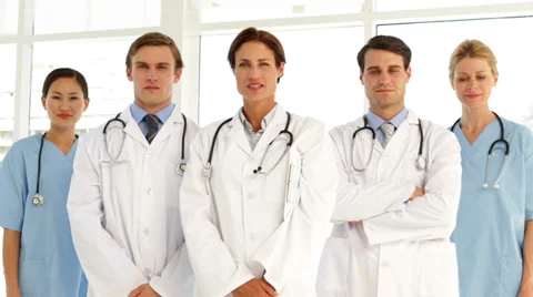 Confident medical team looking at camera and giving thumbs up Stock Footage
