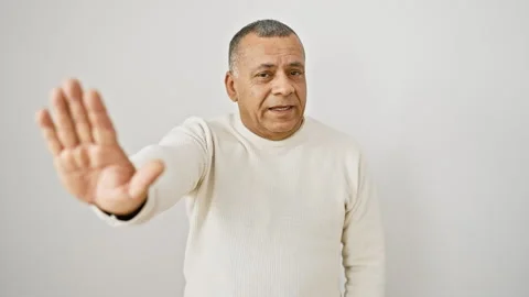 Confident middle-aged latin man in sweater, assertively holding stop hand g.. Stock Footage 267212901