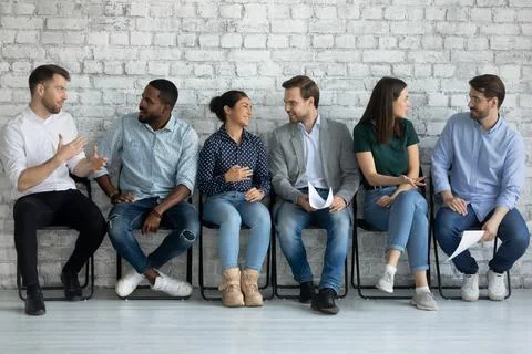 Confident motivated diverse job candidates and competitors making friends Stock Photos