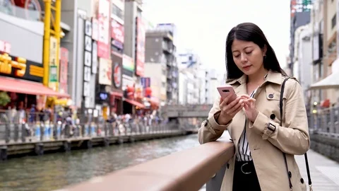 Confident office lady standing next to the river Stock Footage 96727438