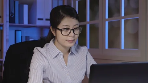 Confident office lady work late using laptop Video stock 101268128
