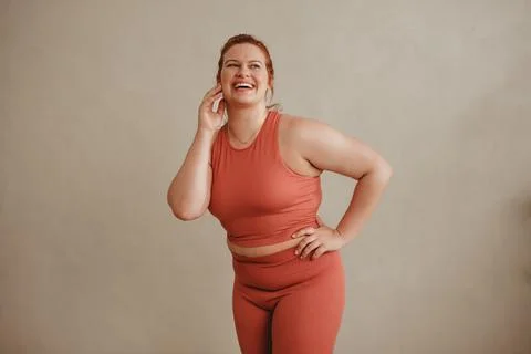 Confident plus size woman in sports clothing Stock Photos