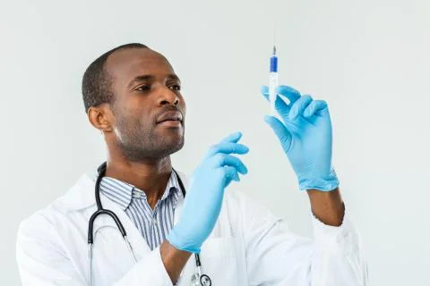 Confident practitioner going to make an injection Stock Photos