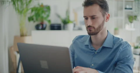 Confident professional browsing internet on laptop Stock Footage 267303166