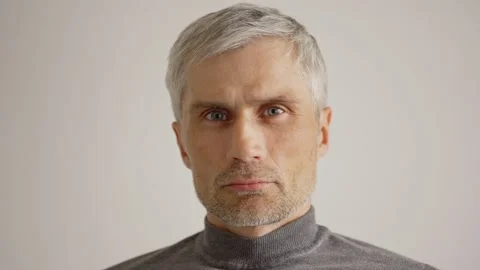 Confident senior man looking at camera Stock Footage 133525830