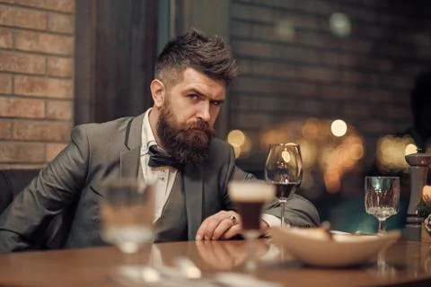 Confident sharp dressed man with glass of wine Illustrazione stock