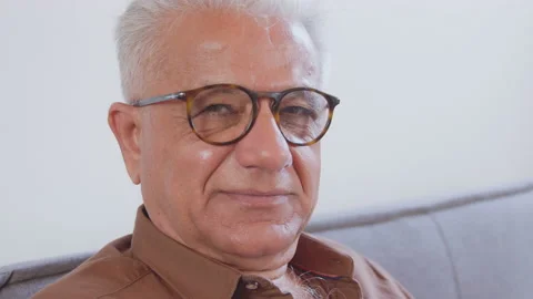 Confident smiling older man looking at camera sitting at home office. Happy Stock Footage 135071276