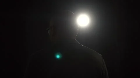Confident successful speaker man talking on stage with spotlight strike through. Stock Footage 241085098
