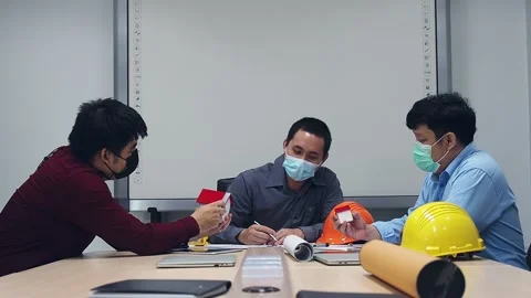 Confident team of architect and engineer discussing together in a meeting room. Stock Footage 177522901