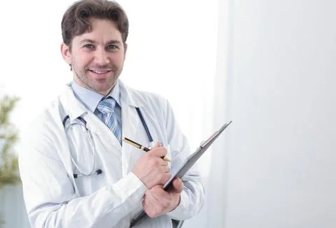 Confident therapist with documents on a light background. Stock Photos