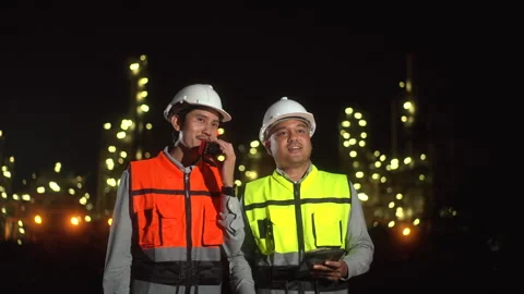 Confident two engineers man inspection discussion with tablet walking front. Stock Footage 273460770