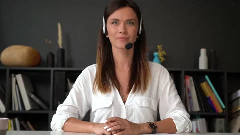 Confident woman in headset talking to Stock Video Pond5