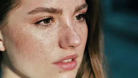 Confident woman’s eyes opening while looking at Camera, having long nice Stock Footage 136595266