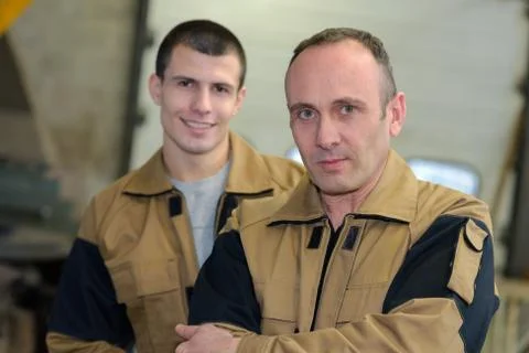 A confident worker and apprentice Stock Photos