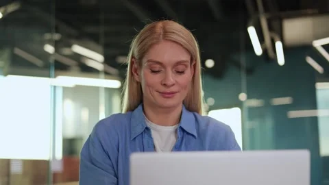 Confident worker using portable computer for distant work in modern workspace Video stock 263195285
